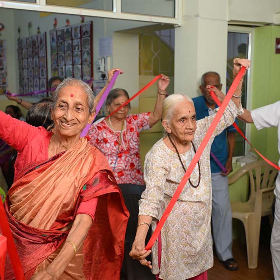 Senior citizens participating in wellness exercise activities at Mamta Day Care Centre by SEEED Foundation